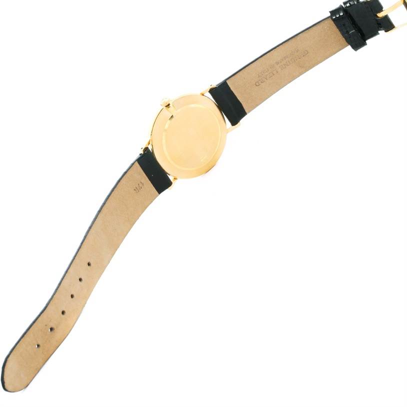 This image shows the back view of a Rolex Cellini 5112 Men's Yellow Gold Champagne Dial 5112 Men's Yellow Gold Champagne Dial watch, focusing on the case back and leather strap.