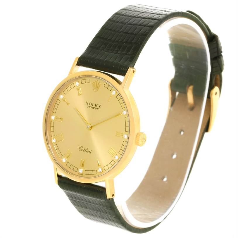 The image shows a Rolex Cellini 5112 Men's Yellow Gold Champagne Dial 5112 Men's Yellow Gold Champagne Dial watch at a slight side angle, featuring a gold case, gold dial, and a black leather strap.