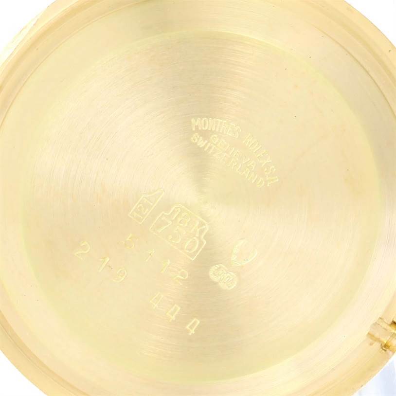 The image shows the inner case back of a Rolex Cellini 5112 Men's Yellow Gold Champagne Dial 5112 Men's Yellow Gold Champagne Dial watch, featuring engravings and hallmarks.