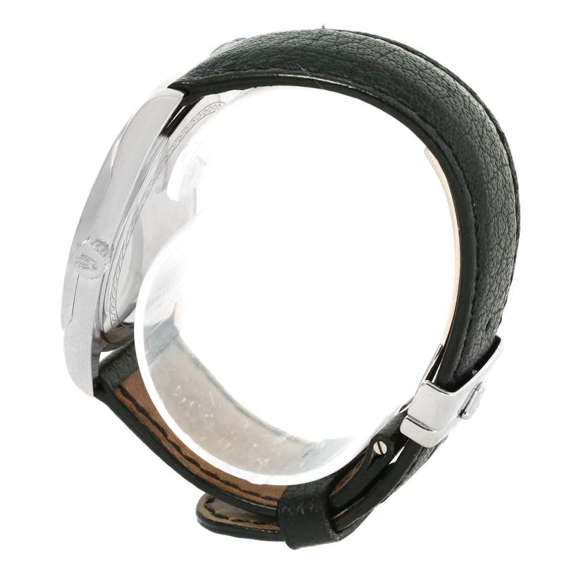 This image shows a partial side view of the Rolex Cellini 4243 Men's White Gold Black Dial 4243 Men's White Gold Black Dial watch, highlighting the watch face, case, and leather strap.