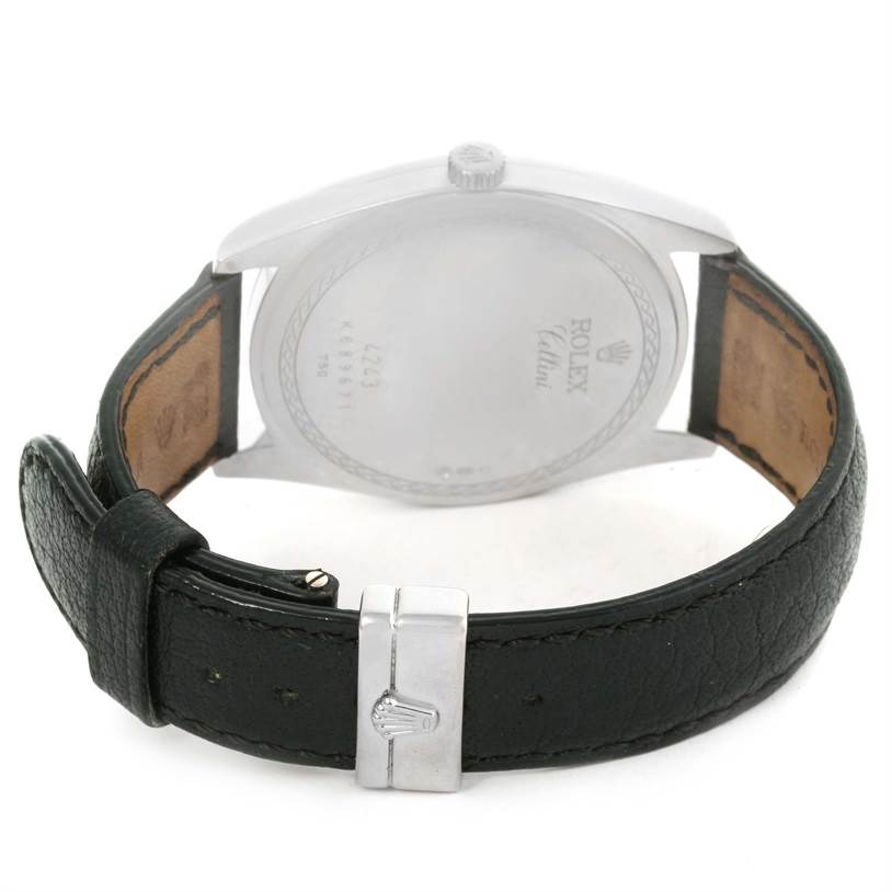 This is the back view of a Rolex Cellini 4243 Men's White Gold Black Dial 4243 Men's White Gold Black Dial watch, showcasing the case back, crown, and black leather strap with buckle.
