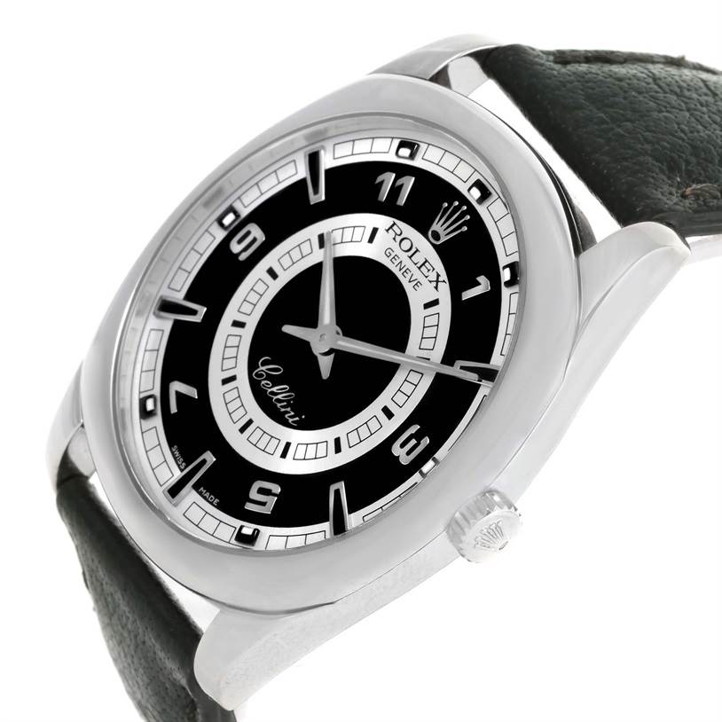 This Rolex Cellini 4243 Men's White Gold Black Dial 4243 Men's White Gold Black Dial watch is shown from an angled side view, highlighting its face, bezel, crown, and leather strap.