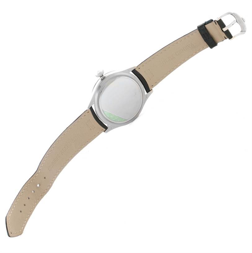 The image shows the back view of a Rolex Cellini 50509 Men's White Gold White Dial 50509 Men's White Gold White Dial watch, highlighting the leather strap and metal clasp.