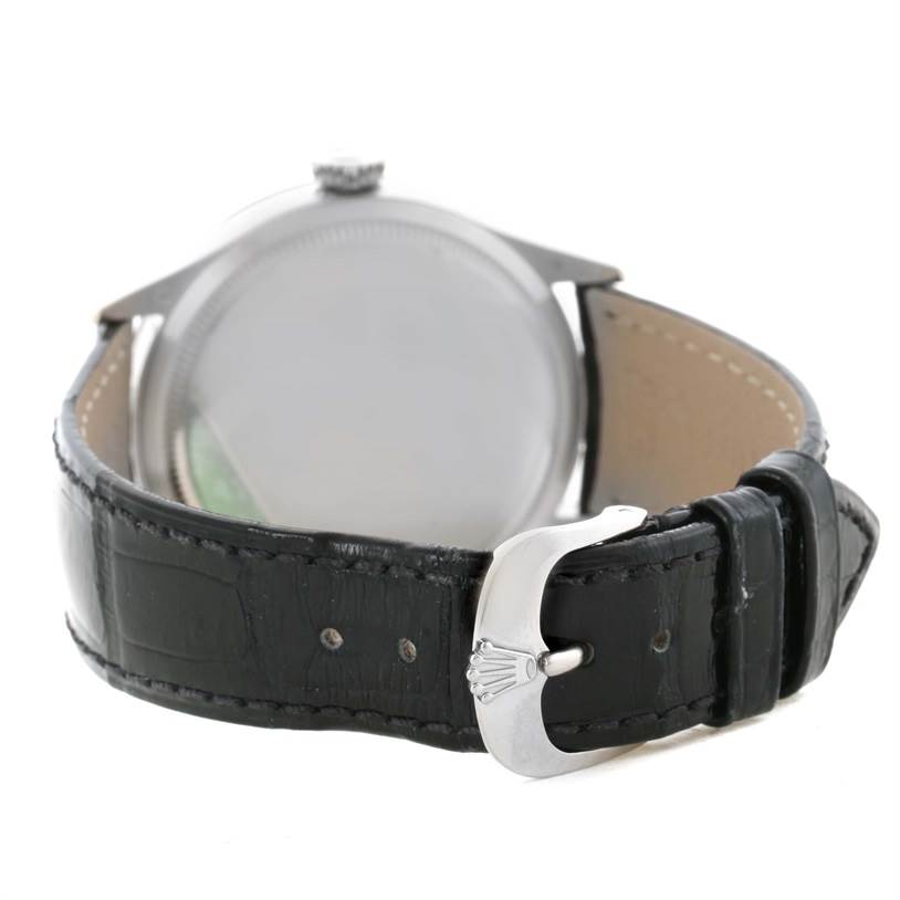 The image shows the rear view of a Rolex Cellini 50509 Men's White Gold White Dial 50509 Men's White Gold White Dial watch, focusing on the leather strap and the buckle with the Rolex logo.