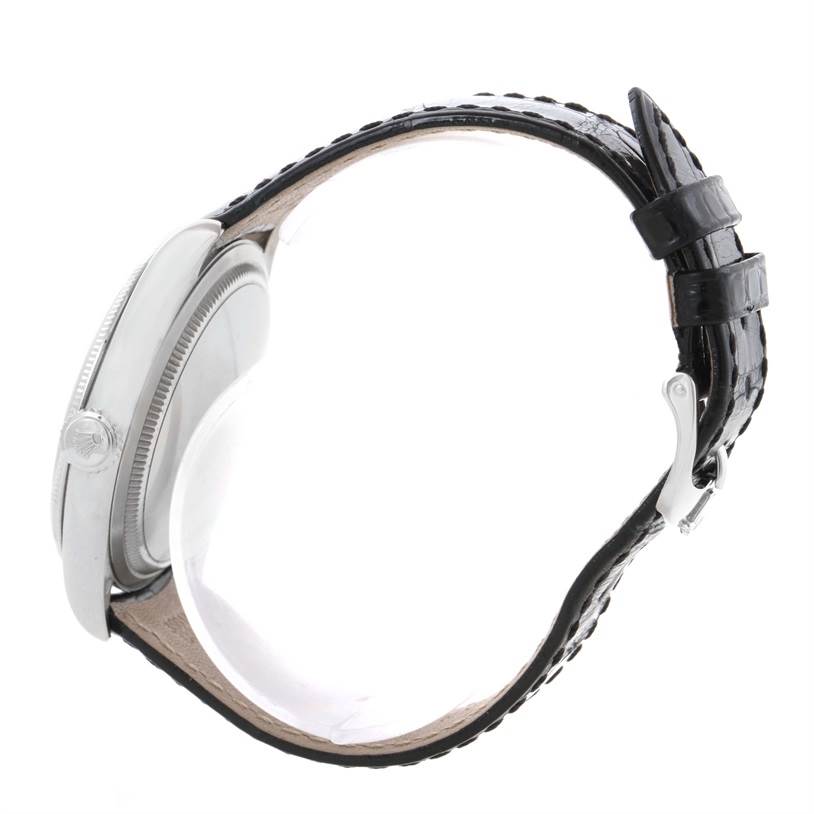 This image shows the side profile of a Rolex Cellini 50509 Men's White Gold White Dial 50509 Men's White Gold White Dial watch, highlighting the case, crown, and leather strap with a clasp.