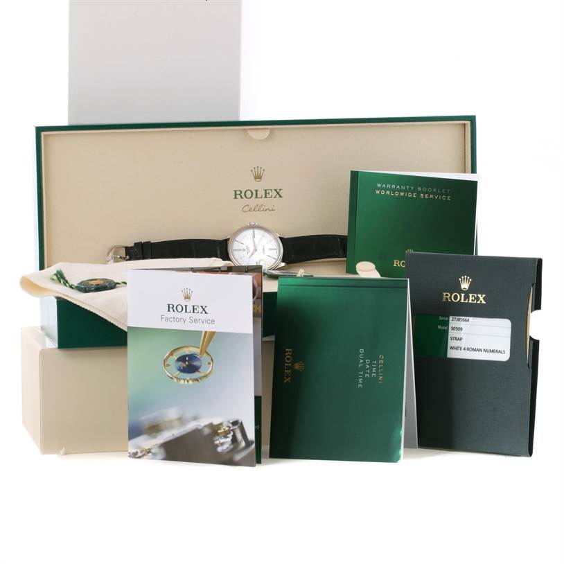 The Rolex Cellini 50509 Men's White Gold White Dial 50509 Men's White Gold White Dial watch is displayed inside its open box, surrounded by warranty booklets and factory service booklets.