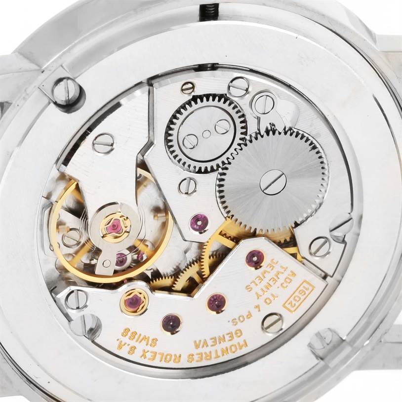 The image shows the intricate internal mechanical movement and parts of a Rolex Cellini 5115 White Gold Silver Dial 5115 White Gold Silver Dial watch from the back view.