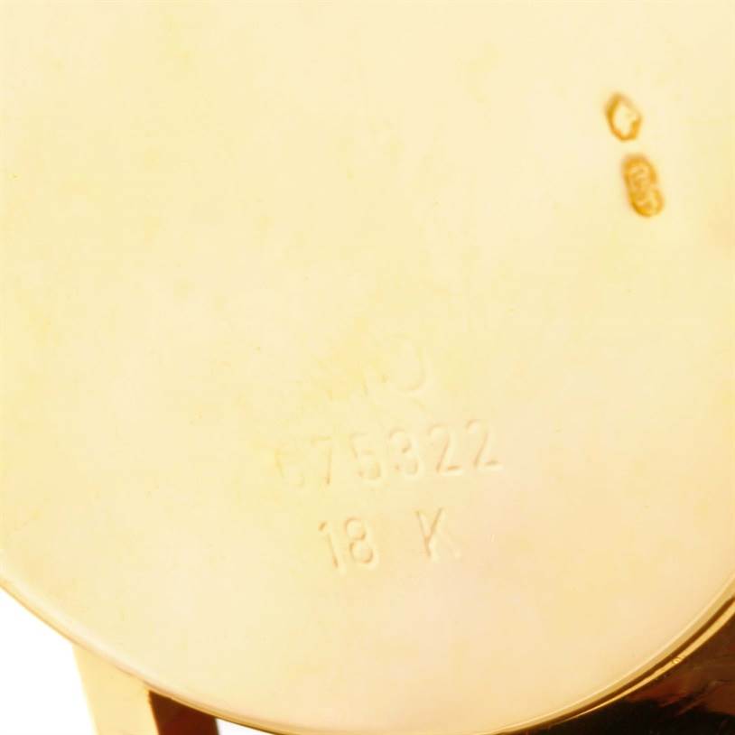 The image shows the back case of a Rolex Cellini 5115 Men's Yellow Gold Black Dial 5115 Men's Yellow Gold Black Dial watch, displaying its 18k gold stamp and serial number.