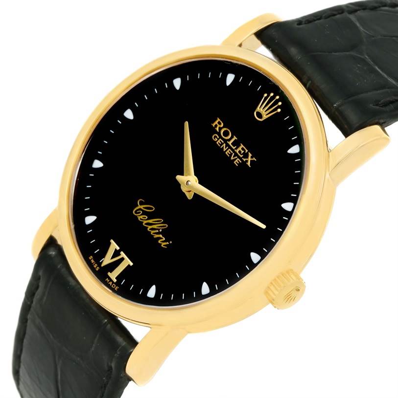 The Rolex Cellini 5115 Men's Yellow Gold Black Dial 5115 Men's Yellow Gold Black Dial watch is shown at a slight angle, highlighting its black dial, gold case, crown, and black leather strap.