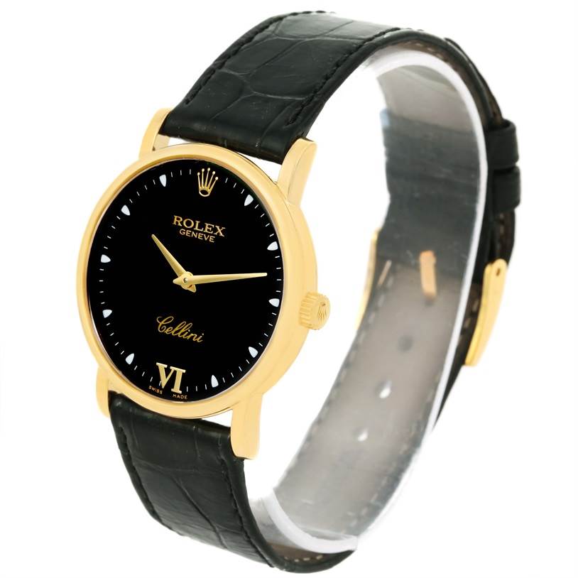 The Rolex Cellini 5115 Men's Yellow Gold Black Dial 5115 Men's Yellow Gold Black Dial watch is shown from a three-quarter angle, displaying the face, crown, and strap.