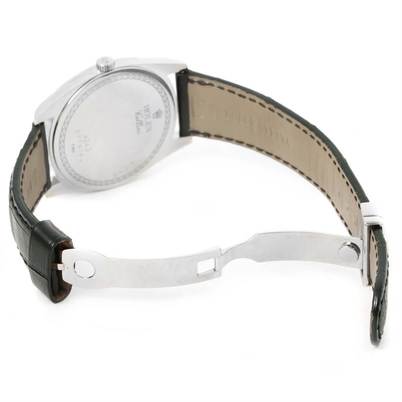 This is the back view of a Rolex Cellini 4243 Men's White Gold Black Dial 4243 Men's White Gold Black Dial watch, showing the clasp, leather strap, and case back.