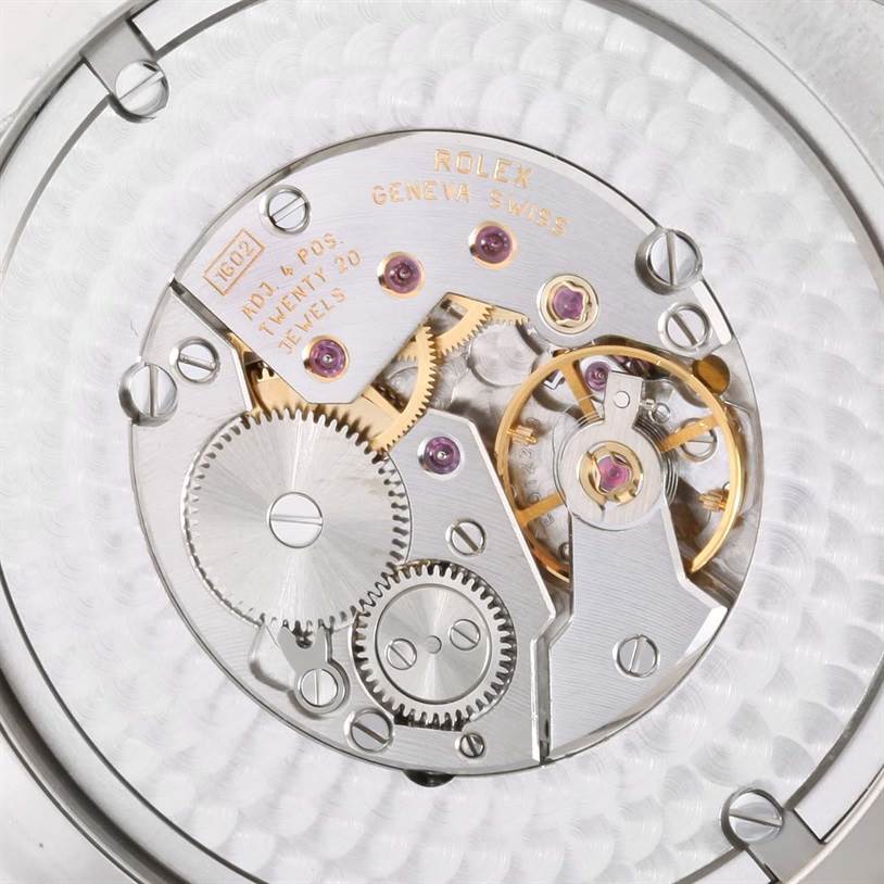 This image shows a close-up view of the intricate movement and gears of a Rolex Cellini 4243 Men's White Gold Black Dial 4243 Men's White Gold Black Dial watch.