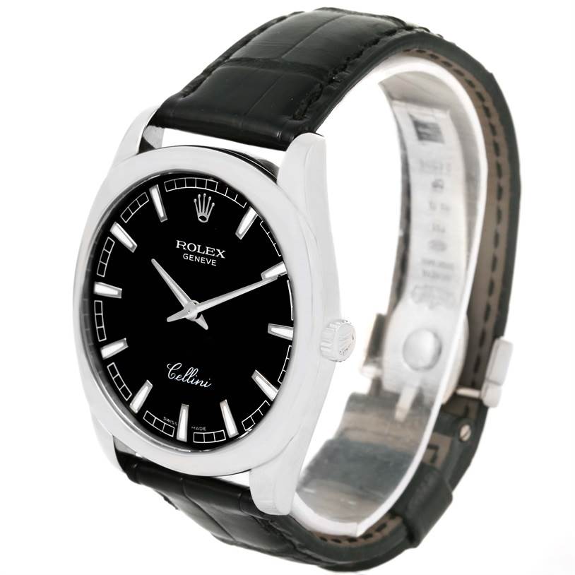 The image shows a Rolex Cellini 4243 Men's White Gold Black Dial 4243 Men's White Gold Black Dial watch angled to display the black dial, markers, hands, and a portion of the leather strap and bezel.