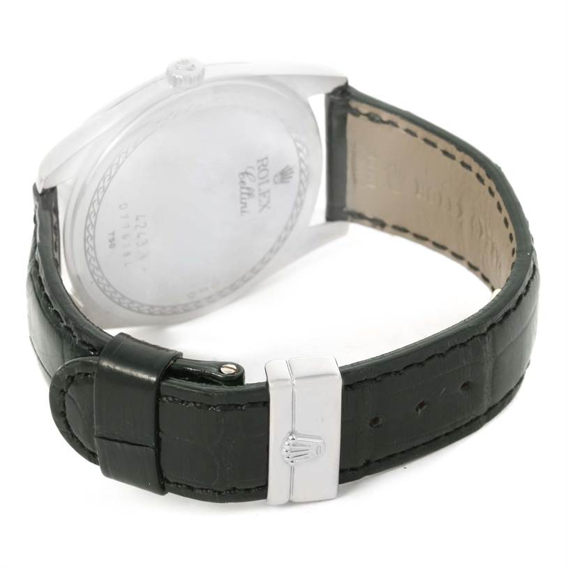 This image shows the back case, crown, and leather strap of a Rolex Cellini 4243 Men's White Gold Black Dial 4243 Men's White Gold Black Dial watch from an angled rear view.