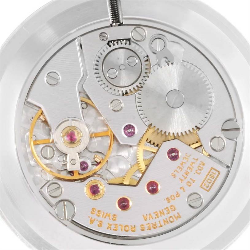 This close-up image shows the intricate inner mechanism and gears of the Rolex Cellini 4112 Men
s White Gold Silver Dial 4112 Men
s White Gold Silver Dial watch model.