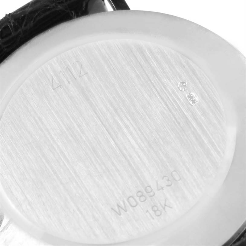 The image shows the back case of a Rolex Cellini 4112 Men
s White Gold Silver Dial 4112 Men
s White Gold Silver Dial watch, displaying the model, serial number, and 18K gold marking.