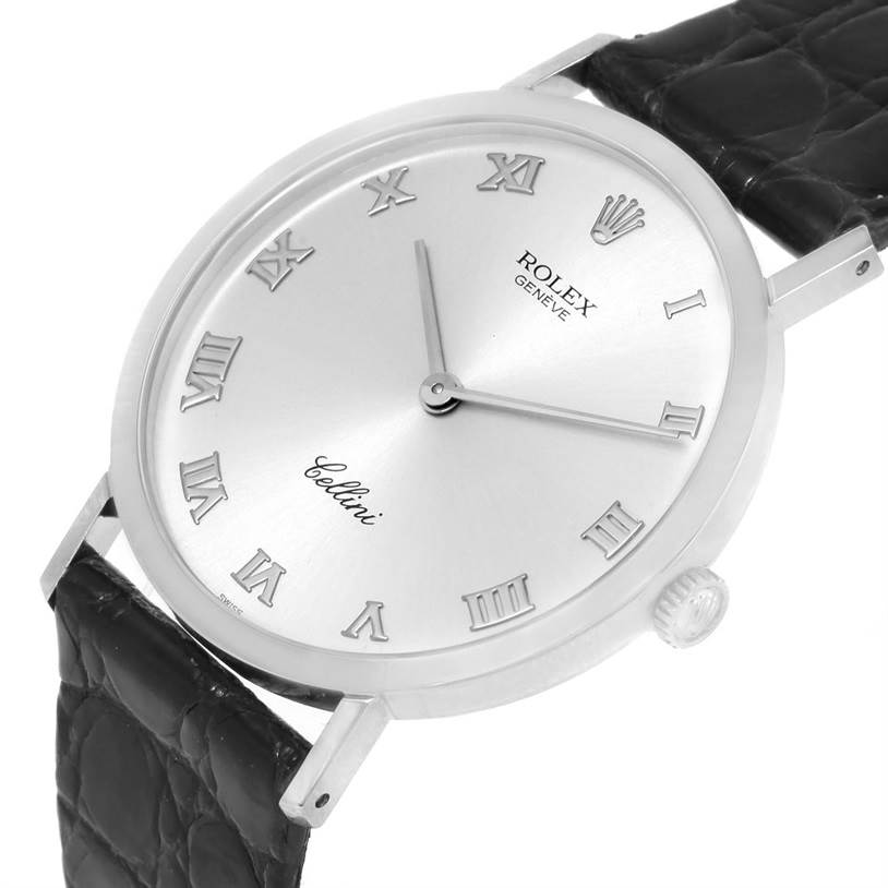 This image shows a Rolex Cellini 4112 Men
s White Gold Silver Dial 4112 Men
s White Gold Silver Dial watch from a slightly angled side view, highlighting its face, crown, and leather strap.