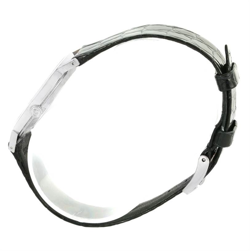 The image shows a side profile of the Rolex Cellini 4112 Men
s White Gold Silver Dial 4112 Men
s White Gold Silver Dial watch, highlighting the slim case and black leather strap.