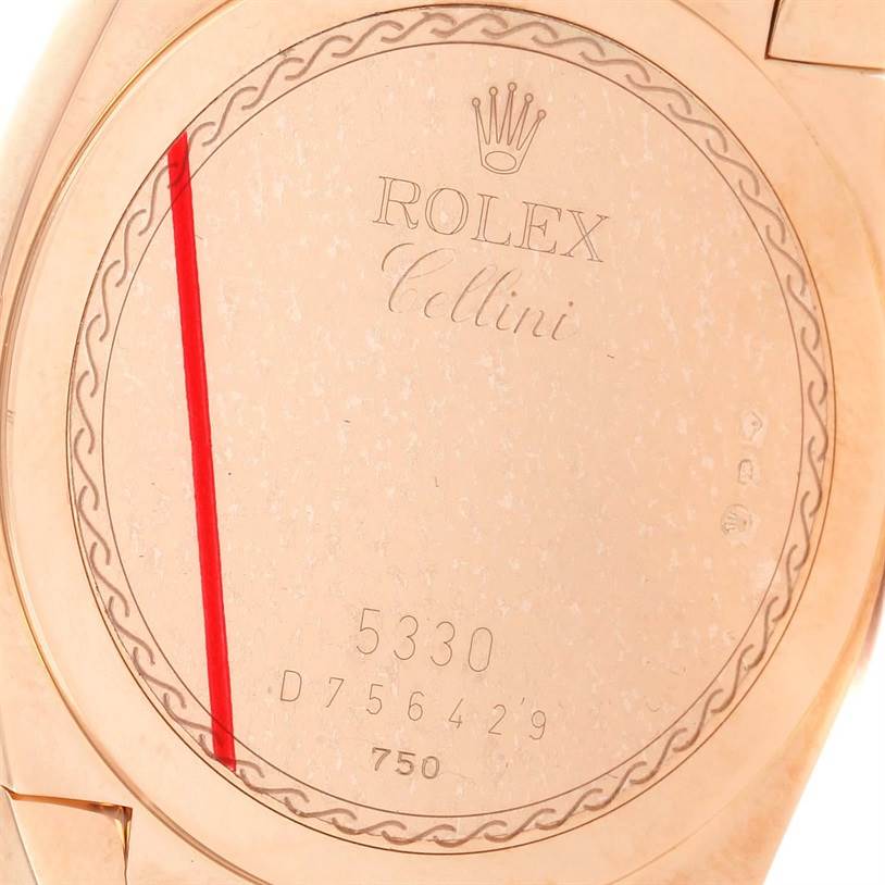 The image shows the case back of a Rolex Cellini 5330 Men's Rose Gold Grey Dial 5330 Men's Rose Gold Grey Dial model, highlighting its engravings and serial numbers.