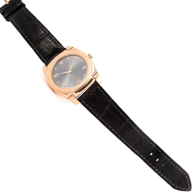 The image shows a Rolex Cellini 5330 Men's Rose Gold Grey Dial 5330 Men's Rose Gold Grey Dial watch at a slight angle, highlighting its black leather strap and gold case with a black dial.