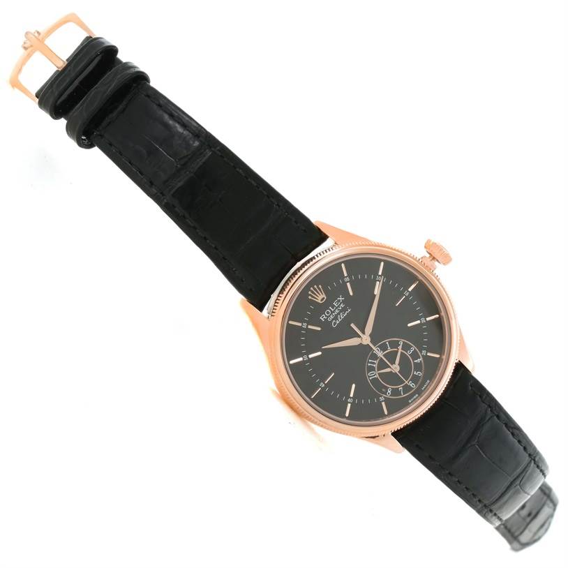 The image shows a Rolex Cellini 50525 Men's Rose Gold Black Dial 50525 Men's Rose Gold Black Dial watch at an angled top view, highlighting the face, strap, and buckle.