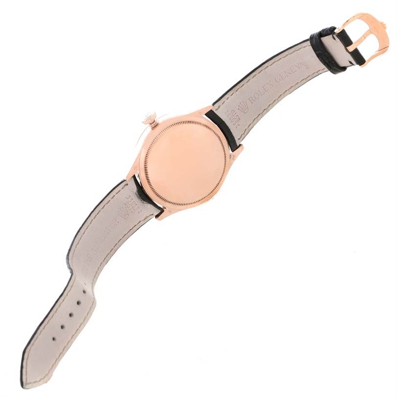 The image shows the back view of a Rolex Cellini 50525 Men's Rose Gold Black Dial 50525 Men's Rose Gold Black Dial watch, highlighting its leather strap and caseback.