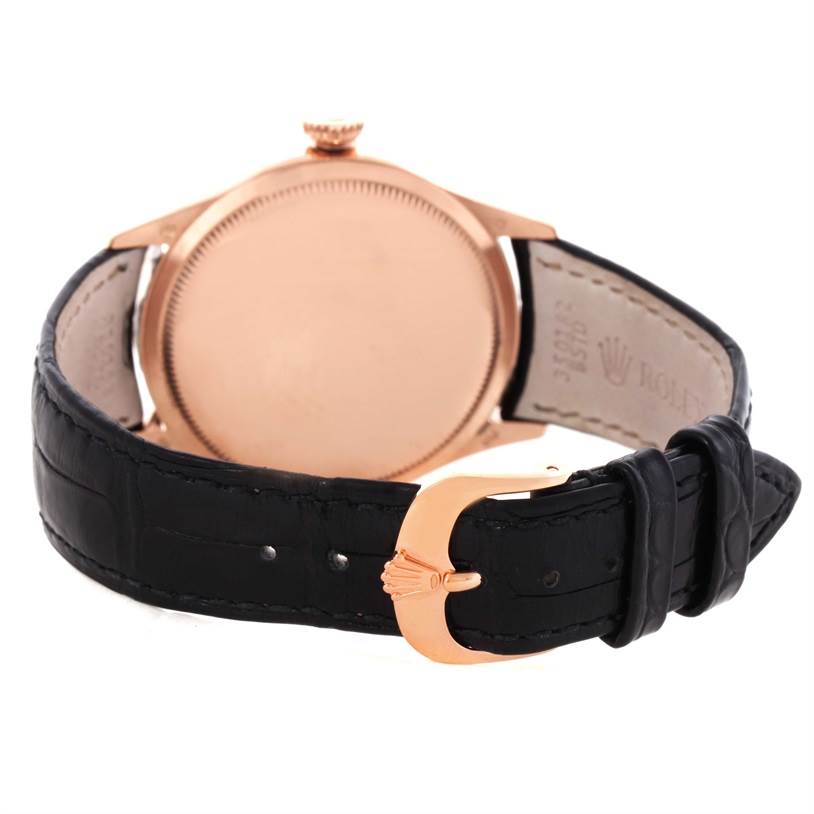 This image shows the back and clasp of a Rolex Cellini 50525 Men's Rose Gold Black Dial 50525 Men's Rose Gold Black Dial watch at an angle, highlighting its case and black leather strap.