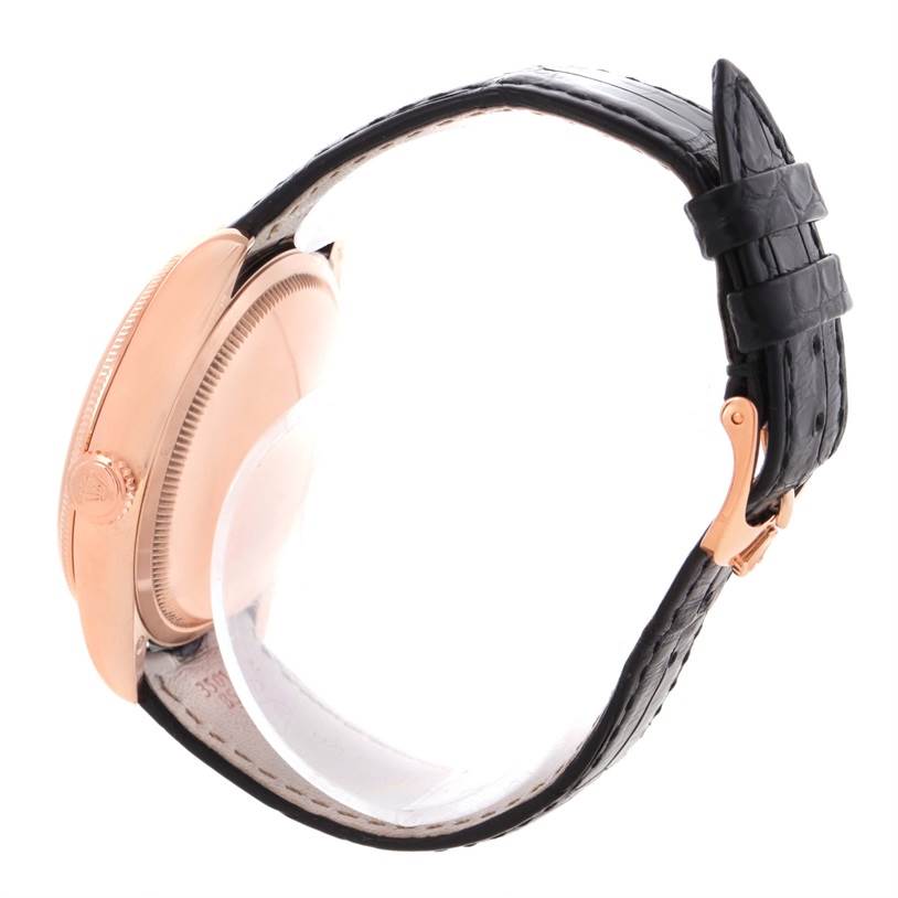 This image shows a side view of a Rolex Cellini 50525 Men's Rose Gold Black Dial 50525 Men's Rose Gold Black Dial watch, highlighting its case, crown, and leather strap.