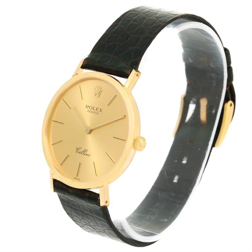 The image shows a side angle of a Rolex Cellini 4112 Men's Yellow Gold Champagne Dial 4112 Men's Yellow Gold Champagne Dial watch, highlighting its gold case, black leather strap, and crown.