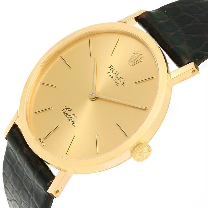 The image shows a Rolex Cellini 4112 Men's Yellow Gold Champagne Dial 4112 Men's Yellow Gold Champagne Dial watch from an angled view, highlighting the gold dial, crown, and black leather strap.