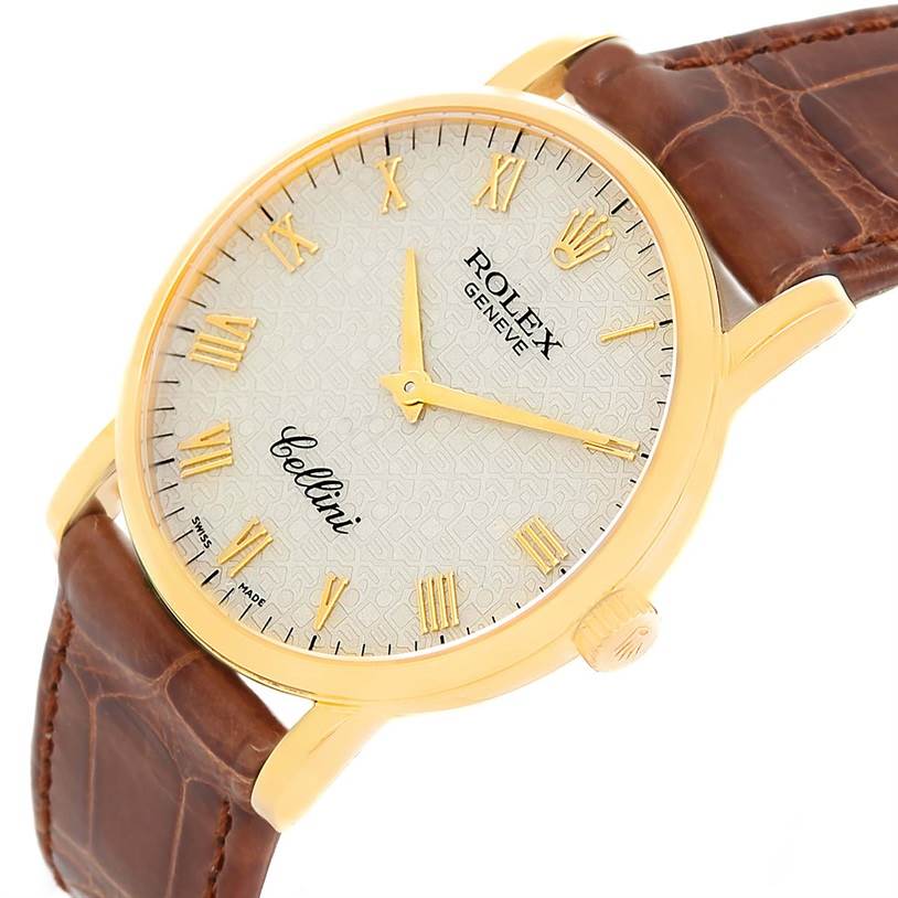 The image shows a close-up of the Rolex Cellini 5115 Men
s Yellow Gold Beige Dial 5115 Men
s Yellow Gold Beige Dial watch face at an oblique angle, highlighting the gold case and brown leather strap.