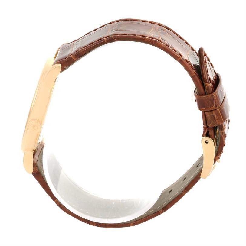 This image shows the Rolex Cellini 5115 Men
s Yellow Gold Beige Dial 5115 Men
s Yellow Gold Beige Dial watch from a side angle, highlighting the brown leather strap and gold clasp.