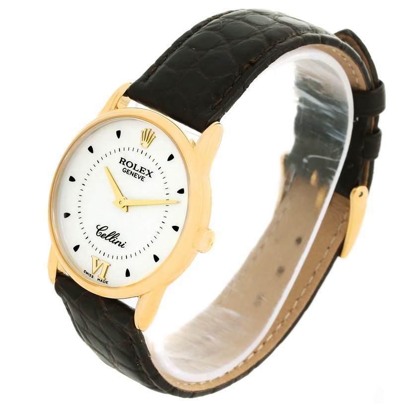 The Rolex Cellini 5116 Men
s Yellow Gold Silver Dial 5116 Men
s Yellow Gold Silver Dial watch is shown at an angle displaying the front dial, leather strap, and gold case.