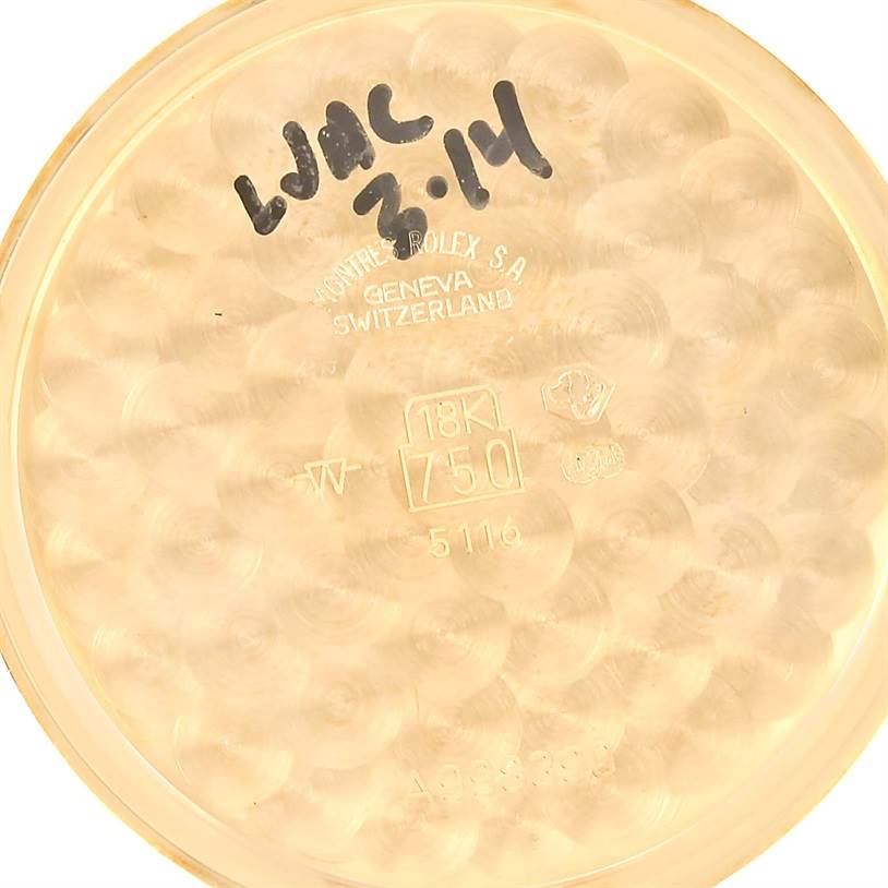 The image shows the inner case back of a Rolex Cellini 5116 Men
s Yellow Gold Silver Dial 5116 Men
s Yellow Gold Silver Dial watch, displaying inscriptions and gold purity marks.