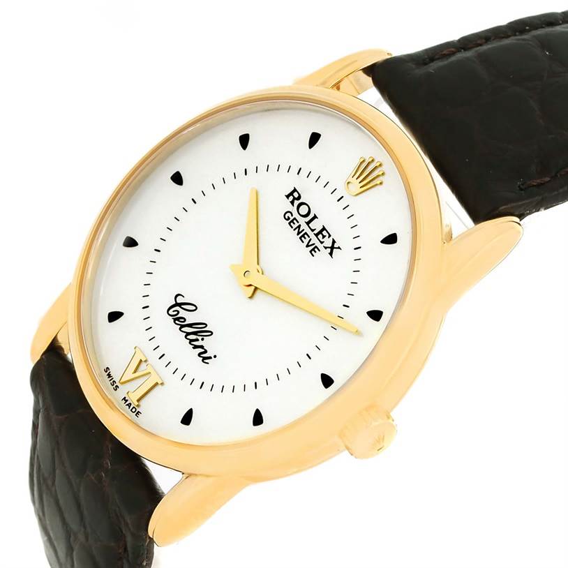 The image shows a Rolex Cellini 5116 Men
s Yellow Gold Silver Dial 5116 Men
s Yellow Gold Silver Dial watch at an angled close-up, highlighting its white dial, gold case, black leather strap, and crown.