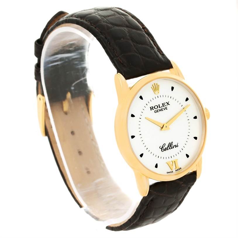 The image shows a side-angle view of a Rolex Cellini 5116 Men
s Yellow Gold Silver Dial 5116 Men
s Yellow Gold Silver Dial model watch with a gold case and a black leather strap.