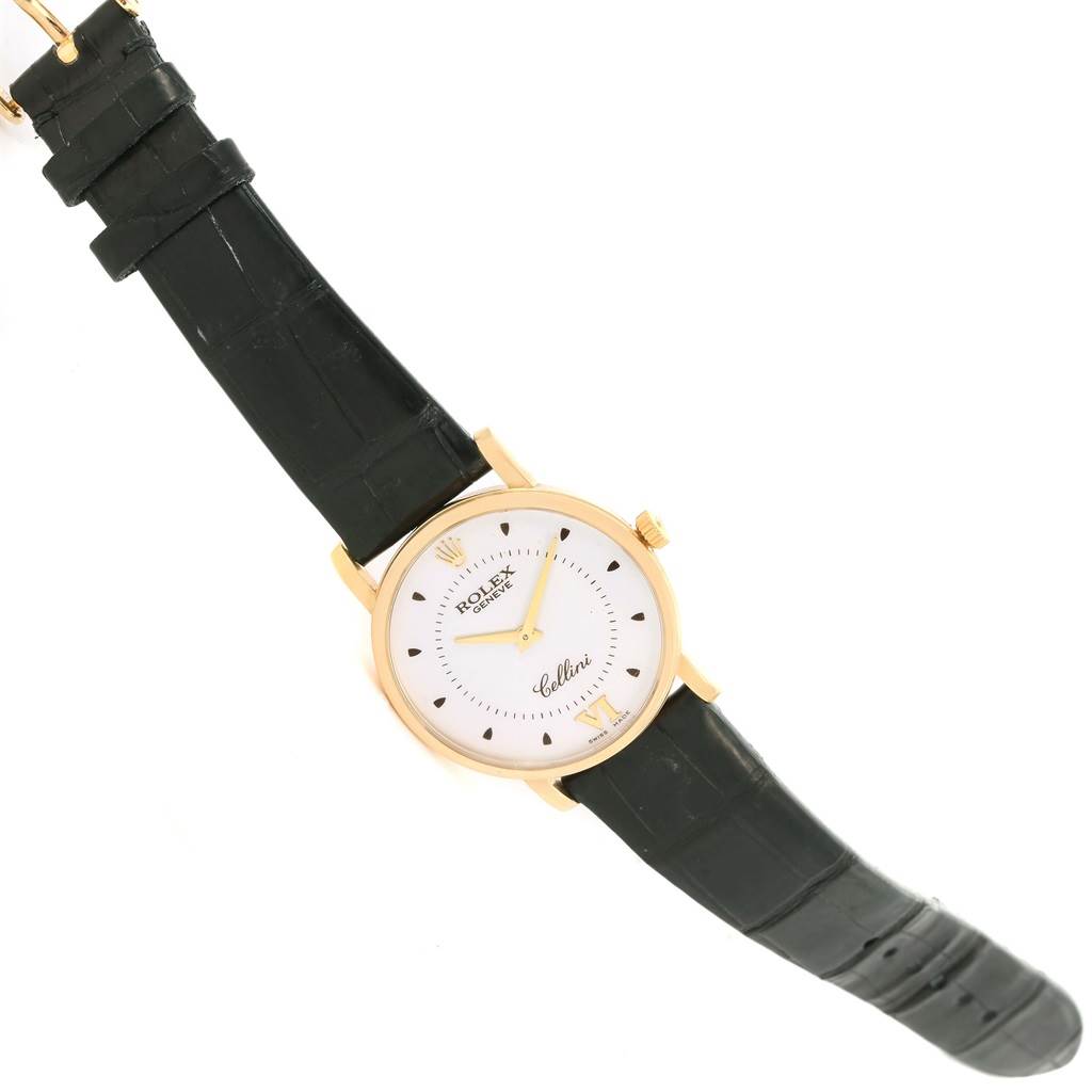 The Rolex Cellini 5115 Men
s Yellow Gold Silver Dial 5115 Men
s Yellow Gold Silver Dial watch is shown at an angled top-down view, highlighting the dial, case, and leather strap.