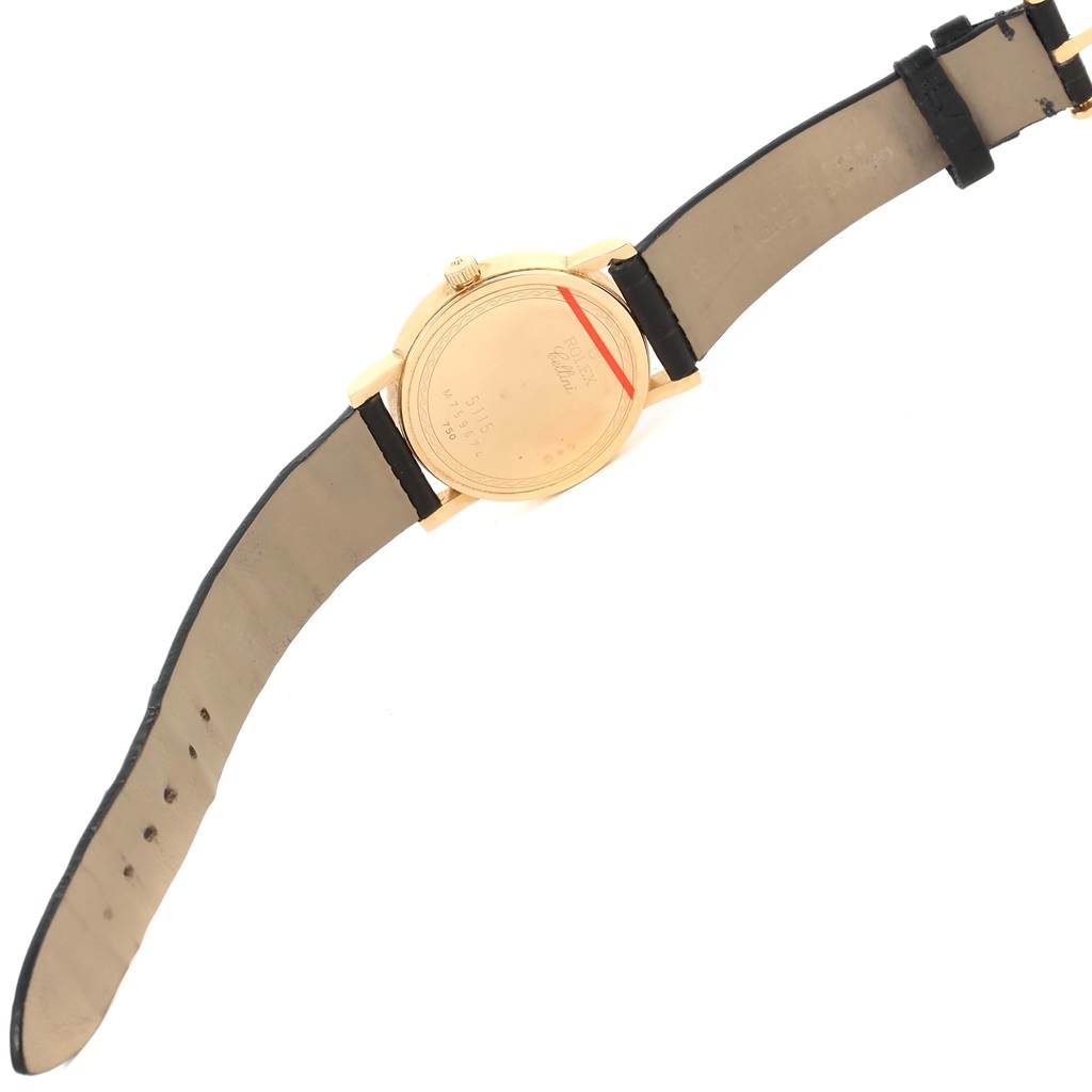 The image shows the back view of a Rolex Cellini 5115 Men
s Yellow Gold Silver Dial 5115 Men
s Yellow Gold Silver Dial watch, including its leather strap and case back details.