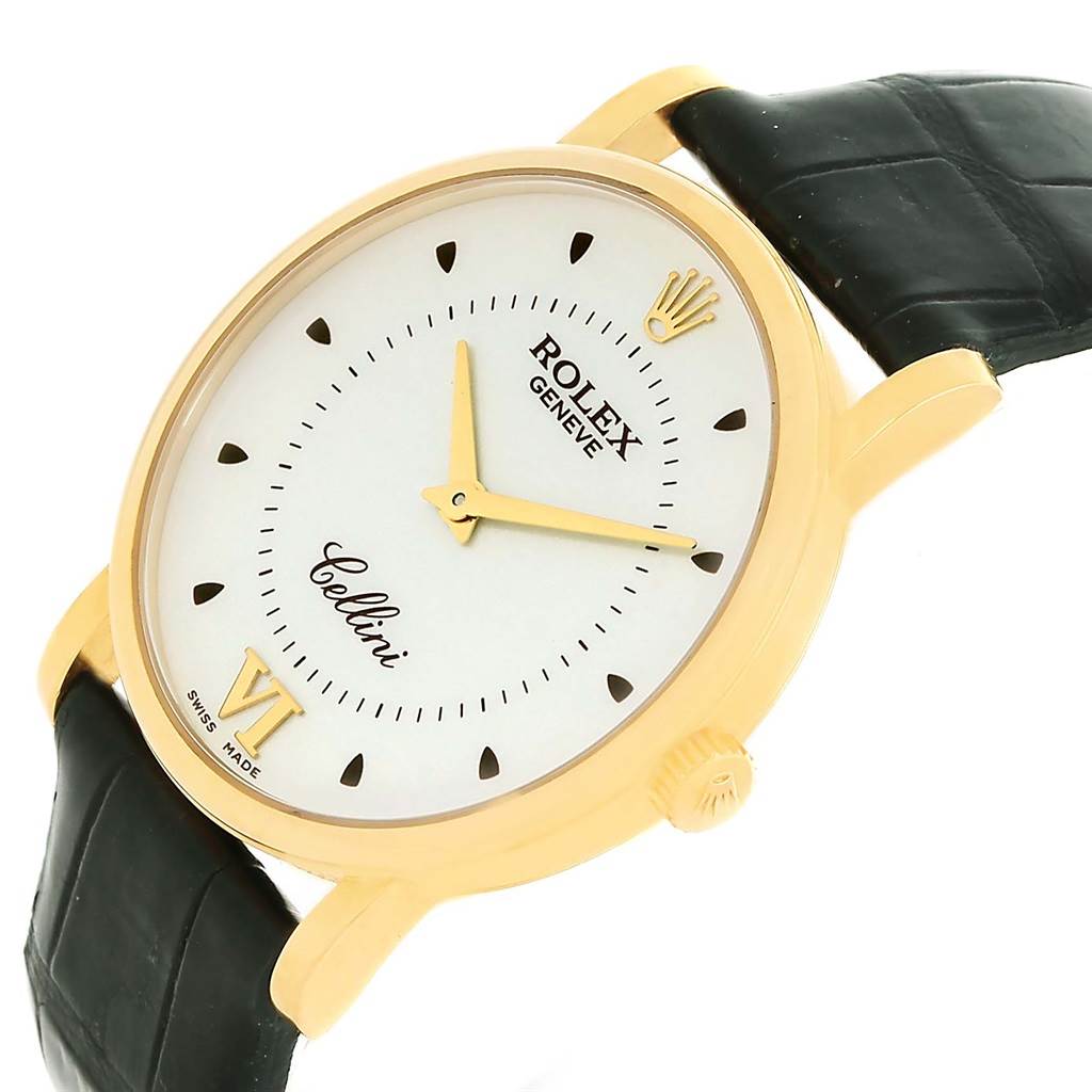 The image shows a side angle of a Rolex Cellini 5115 Men
s Yellow Gold Silver Dial 5115 Men
s Yellow Gold Silver Dial watch, displaying its golden case, white dial, and black strap.