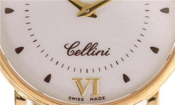 Close-up of the dial on a Rolex Cellini 5115 Men's Yellow Gold Silver Dial 5115 Men's Yellow Gold Silver Dial watch at an angle, showing the brand name, model name, and Roman numeral VI.