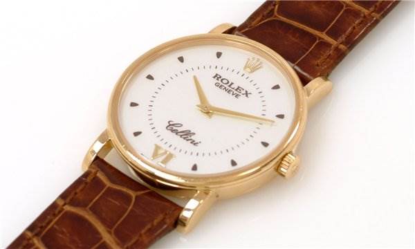 This image shows a Rolex Cellini 5115 Men's Yellow Gold Silver Dial 5115 Men's Yellow Gold Silver Dial watch at a slight angle, displaying the dial, case, crown, and leather strap.