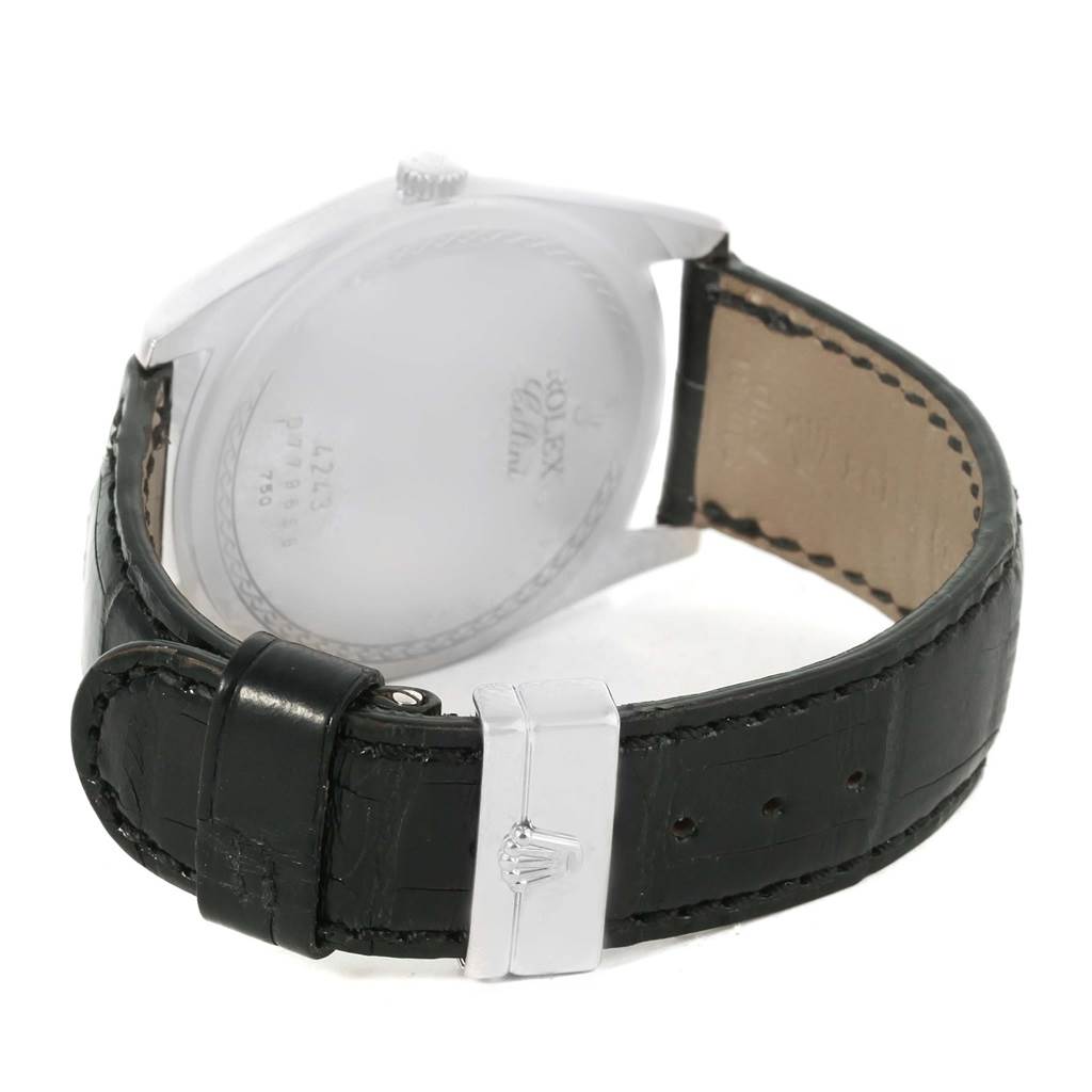 This image displays the back of the Rolex Cellini 4243 Men's White Gold Silver Dial 4243 Men's White Gold Silver Dial watch, highlighting the case back, crown, and leather strap with the clasp.
