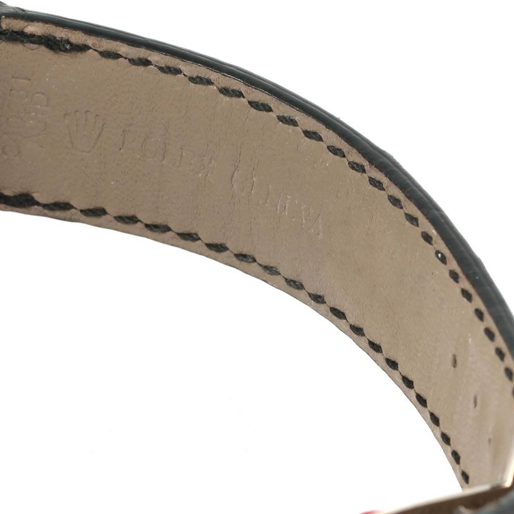 This image shows a close-up of the leather strap of a Rolex Cellini 4243 Men's White Gold Silver Dial 4243 Men's White Gold Silver Dial watch, displaying the embossed brand name and logo.