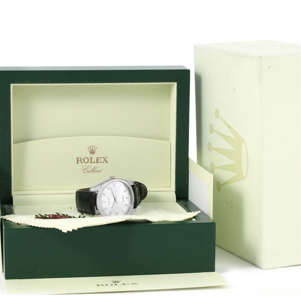The image shows a Rolex Cellini 4243 Men's White Gold Silver Dial 4243 Men's White Gold Silver Dial watch in an open green and cream Rolex case with the outer box partially visible.