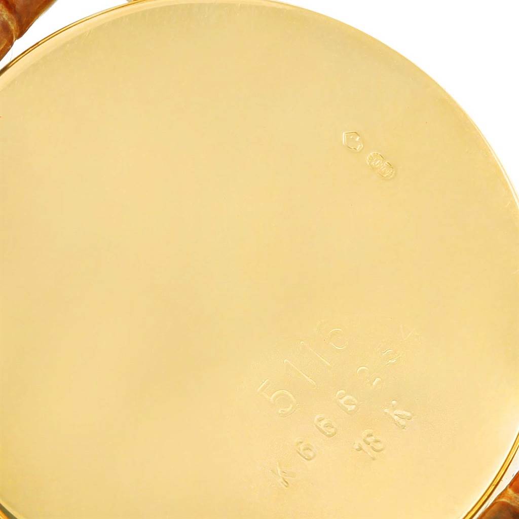 This image shows the engraved back casing of a Rolex Cellini 5116 Men's Yellow Gold Grey Dial 5116 Men's Yellow Gold Grey Dial model watch.