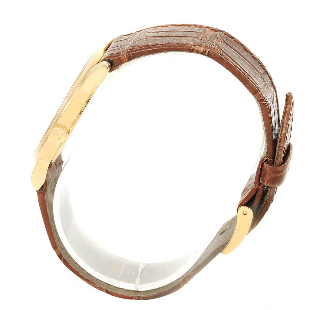 The image shows a side view of the Rolex Cellini 5116 Men's Yellow Gold Grey Dial 5116 Men's Yellow Gold Grey Dial watch, highlighting the gold case and brown leather strap.