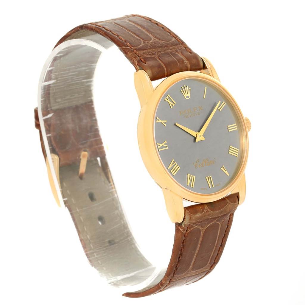 The image shows a side angle of the Rolex Cellini 5116 Men's Yellow Gold Grey Dial 5116 Men's Yellow Gold Grey Dial watch, featuring its brown leather strap and gold-tone case with a grey dial.