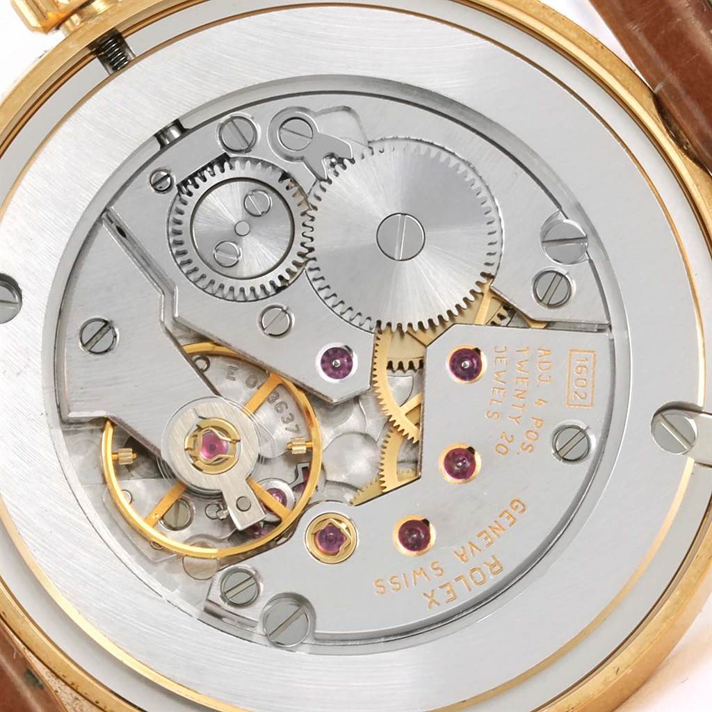 This image shows the intricate inner workings and mechanical parts of a Rolex Cellini 5115 Men
s Yellow Gold Beige Dial 5115 Men
s Yellow Gold Beige Dial model watch viewed from the back.