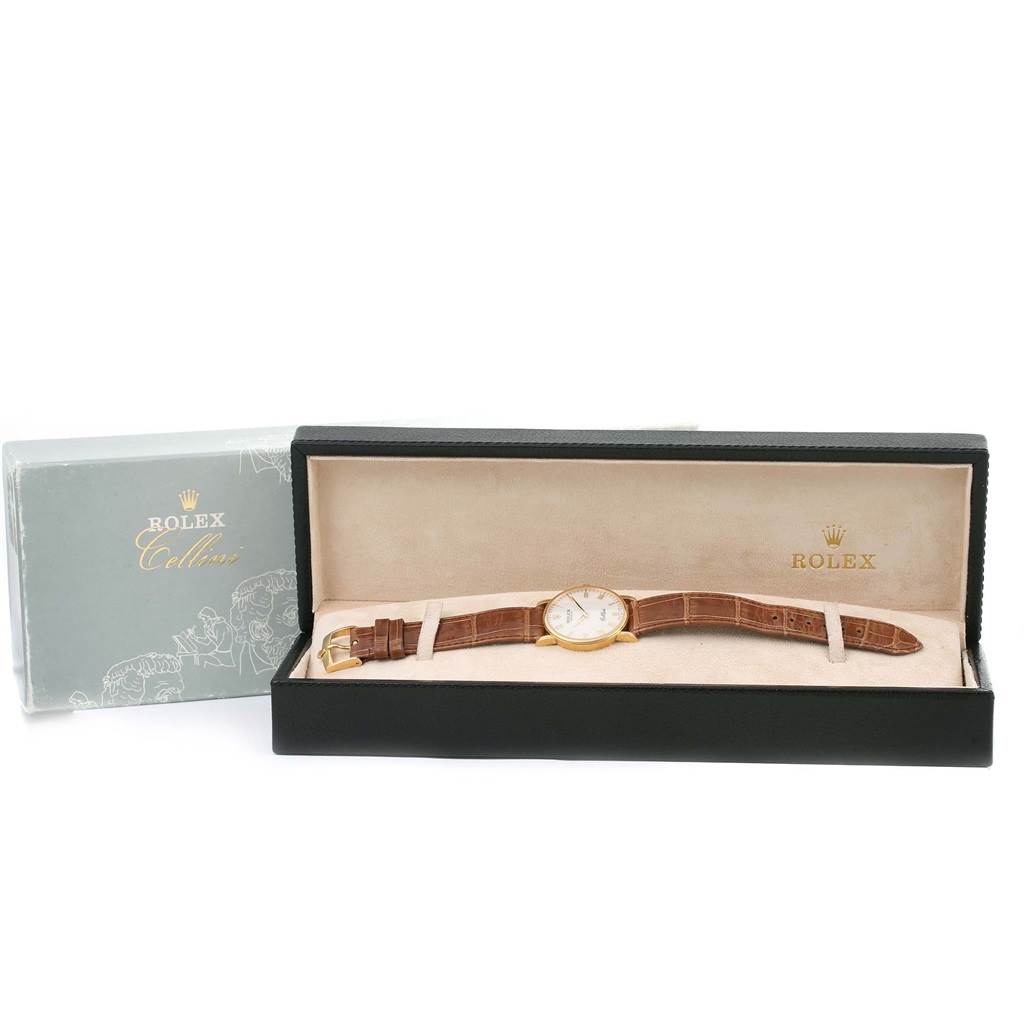 The image shows a Rolex Cellini 5115 Men
s Yellow Gold Beige Dial 5115 Men
s Yellow Gold Beige Dial watch laid flat in an open display case, viewed from a front angle.