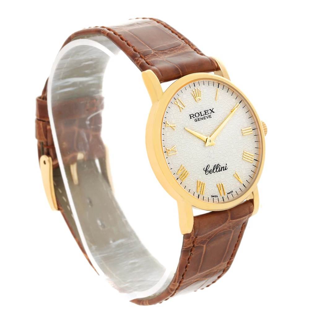 This Rolex Cellini 5115 Men
s Yellow Gold Beige Dial 5115 Men
s Yellow Gold Beige Dial watch is shown from a side angle, displaying the face, bezel, and brown leather strap.